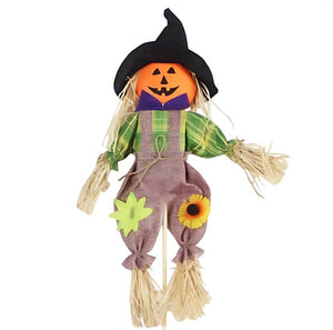 Halloween scarecrow decoration with pumpkin face and witch hat
