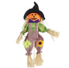 Halloween scarecrow decoration with pumpkin face and witch hat