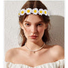 White daisy flower crown worn as a floral headpiece